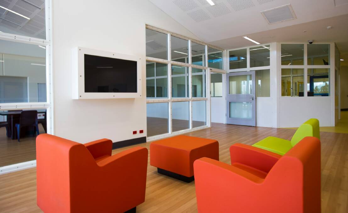 A lounge in the "Cassia" wing of the new secure mental health facility, with television secured in glass, safe furniture and a staff viewing room at the rear. Photo: Elesa Kurtz