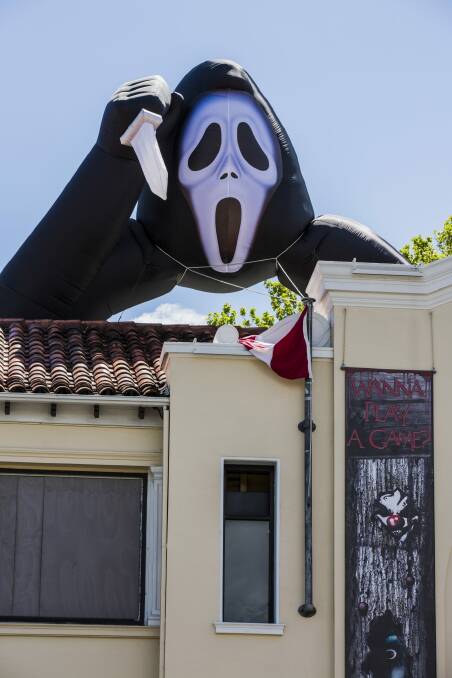 Scary monster: An inflatable Ghostface was installed above Mooseheads this week for Halloween.  Photo: Jamilla Toderas