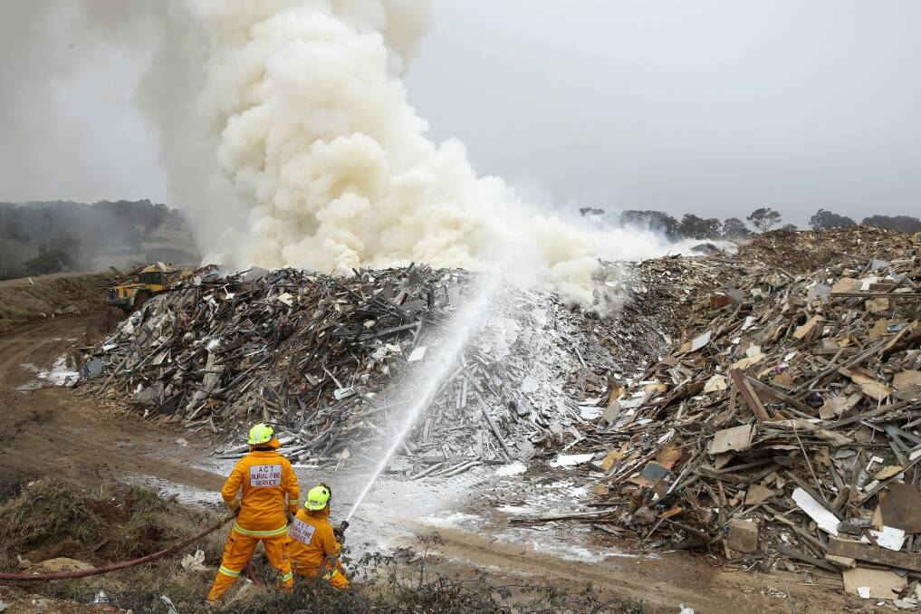 Crews from ACT Fire and Rescue and ACT Rural Fire Service at the scene of the fire on the weekend. Photo: Jeffrey Chan