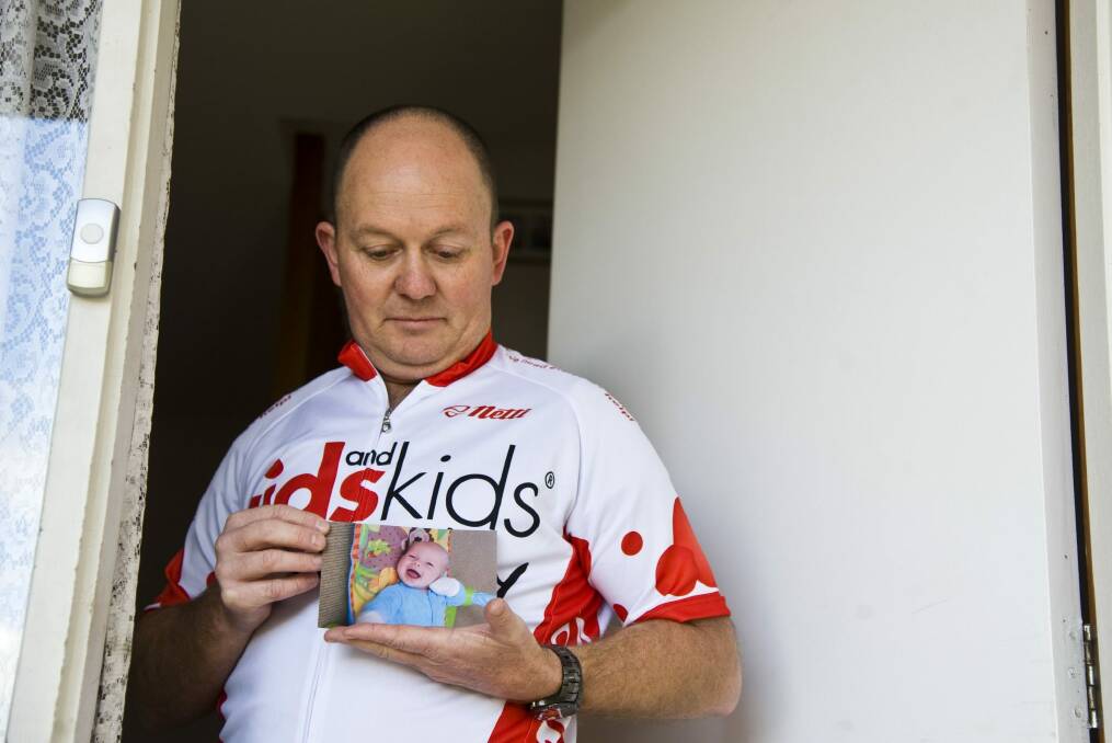 Calwell AFP protective services officer Ian Cross lost his grandson, Lachie, to SIDS in 2011. The pain of the loss never leaves him. Photo: Elesa Kurtz 