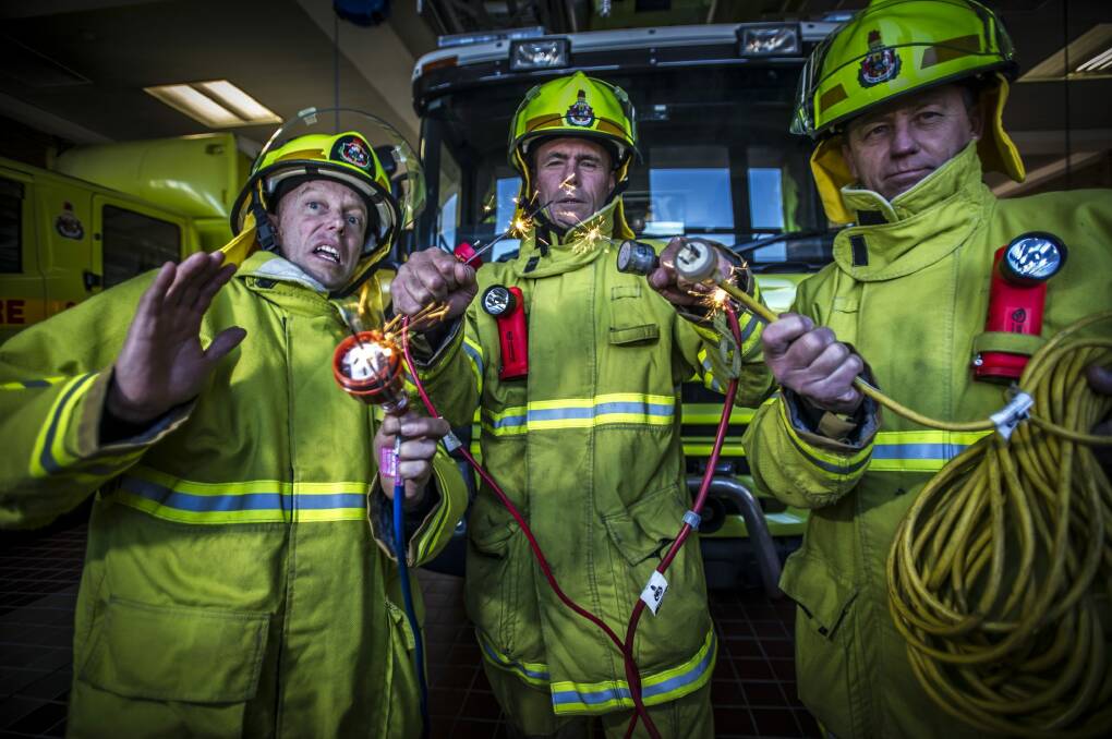 Fyshwick firefighters (from left) Graeme Wiseman, John Hay and Steve Geerdink warn winter appliances could be a fire risk if not checked.  Photo: Karleen Minney