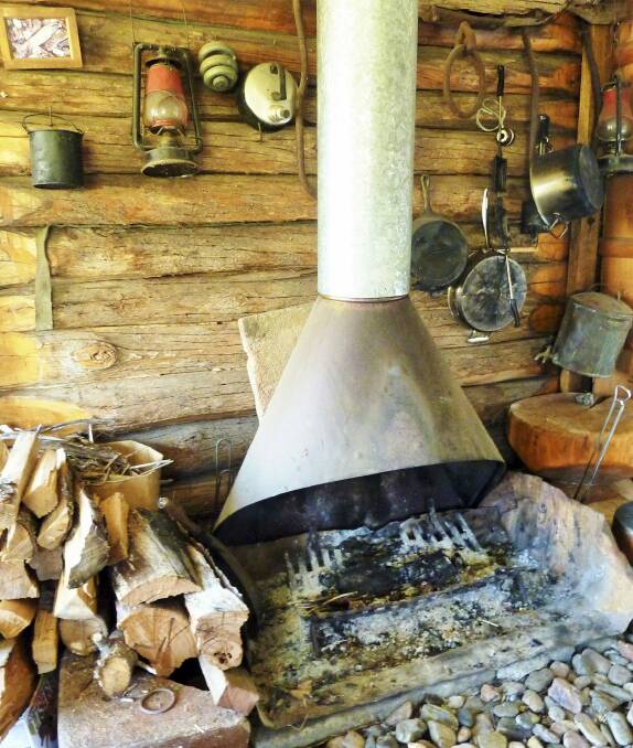 Rustic beauty: The freplace in the log cabin at Korrabri built for Gwen Meredith and her husband. Photo: Tim the Yowie Man
