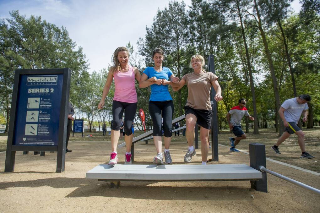Bella Gay, Renee Gallo and Jane Carder at one of the ACT's outdoor fitness stations in Belconnen. Photo: Jay Cronan