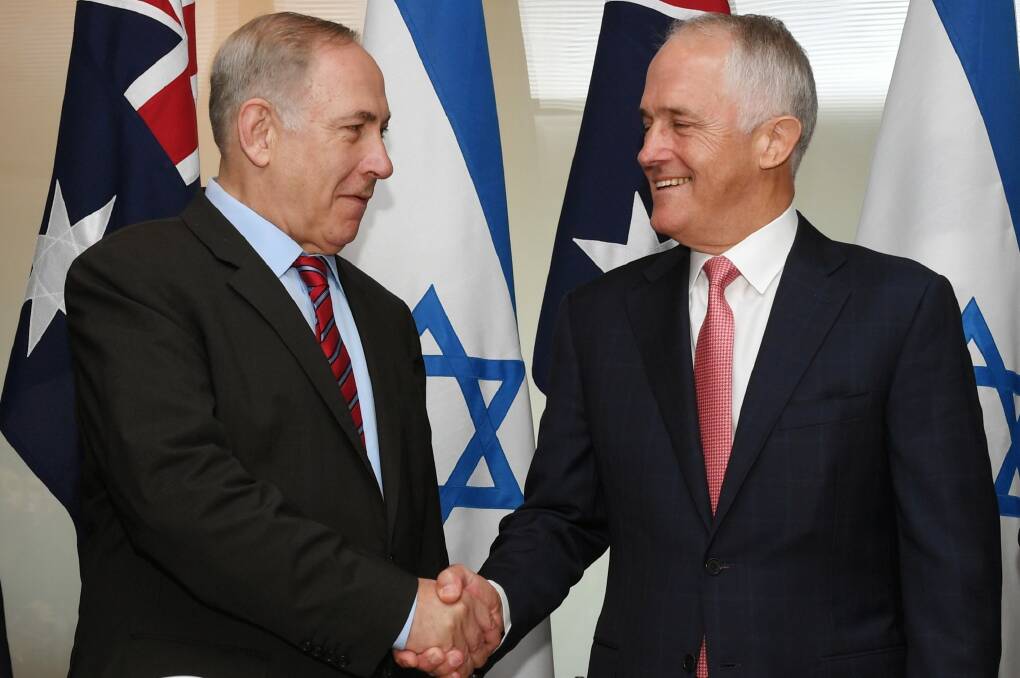 Benjamin Netanyahu and Malcolm Turnbull shake hands during the Israeli Prime Minister's visit this week. Photo: Dean Lewins