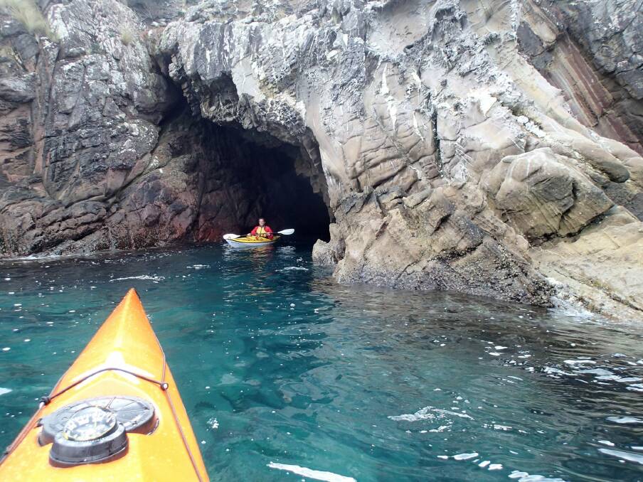 Exploring south coast sea caves by kayak. Photo:  Rob White