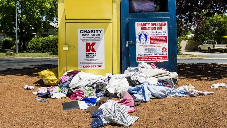 Clothes and other rubbish dumped outside of charity bins at Ainslie shops. Photo: Rohan Thomson