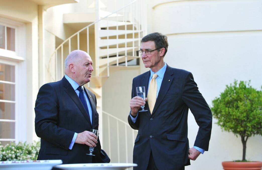 From left, the Governor-General, Sir Peter Cosgrove, and Angus Houston at a welcome reception for the Australian Services Cricket Association's International Defence Cricket Challenge at Government House in Canberra.  Photo: Melissa Adams