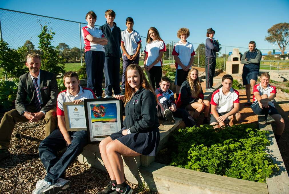 The Duke of Edinburgh award group at Amaroo School with their Young Canberra Citizen of the Year award. Students include Chris Preston and Megan Telford and Amaroo Duke of Edinburgh co-ordinator Jamie Foster. Photo: Elesa Kurtz