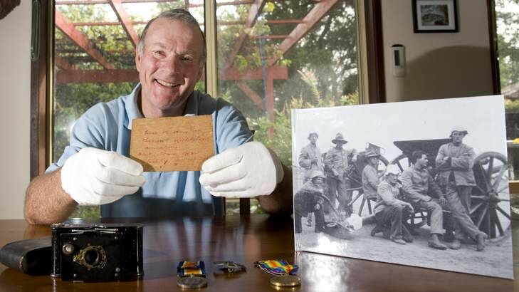 Historic relic: Bill Frost with a piece of the Red Baron's plane recovered by his great grandfather along with images he took during WWI. Photo: Elesa Kurtz