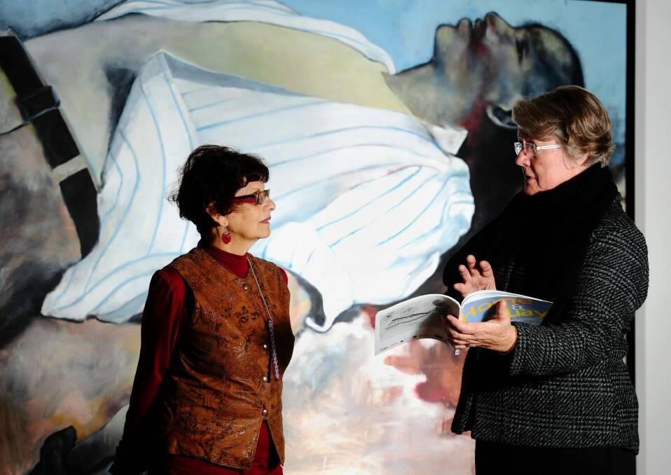 Australia day honoree: Di Johnstone (right) at an exhibition of repatriated South African art from the Ifa Lethu Foundation. Photo: Stuart Walmsley