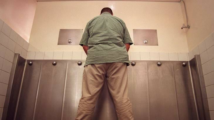 A gentleman using an 'Old Style' urinal. Photo: Simon du Buisson