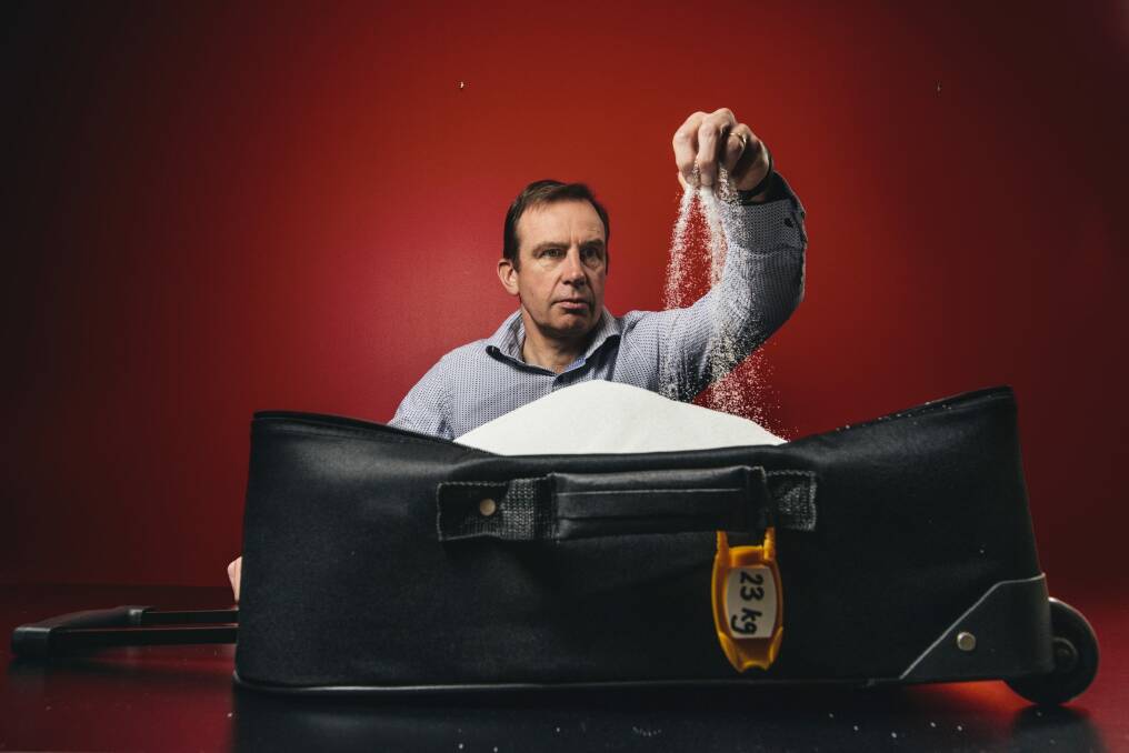 Heart Foundation chief executive Tony Stubbs with suitcase of sugar used as a prop in the LiveLighter campaign. Photo: Rohan Thomson