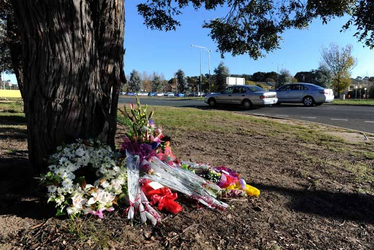 In memory ... flowers were left at the scene of the incident outside the hospital. Photo: Graham Tidy