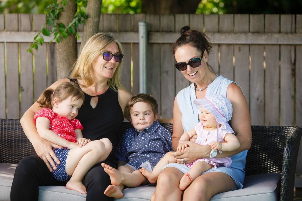 Carrie Graf and Camille Chicheportiche with their four-year-old twins Charli and Bentley, and seven-month-old Soli.  Photo: Sitthixay Ditthavong