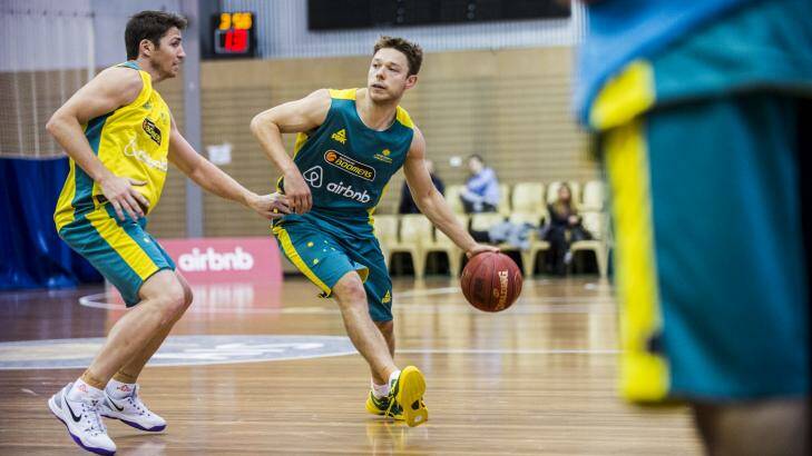 Matthew Dellavedova, right, is guarded by Damien Martin at the Australian Boomers training camp at the AIS on Thursday. Photo: Rohan Thomson