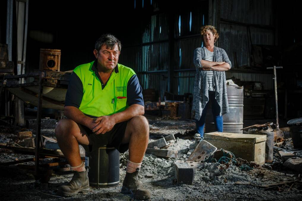 Vanessa and Kevin Lindley are still waiting to finalise insurance claims two months after a bushfire gutted their home in Carwoola. Structural engineers have advised that what is left of their work shed has to be pulled down.  Photo: Sitthixay Ditthavong