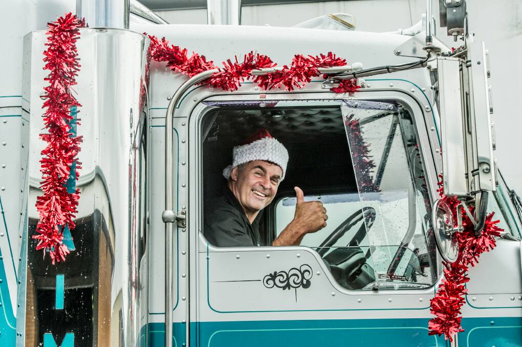 Tony Innaimo's trucks delivered the Christmas care packages to the country families. Photo: Karleen Minney
