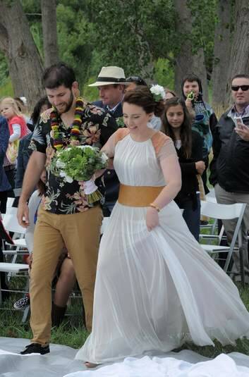 Members of the Burley Griffin Canoe Club, Justin Channels and his bride, Jay Crawford, were married at Molonglo Reach, in front of the club rooms. Photo: Graham Tidy