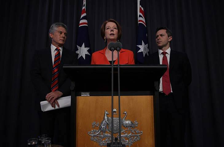 The Gillard government announces cuts to Defence spending - while revealing a $214 million in funding for 12 submarines. Photo: Alex Ellinghausen
