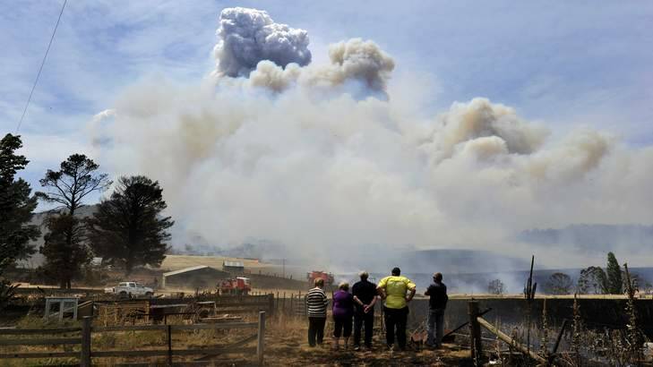 Residents watch the fire on Mount Forest Road near Cooma. Photo: Jay Cronan