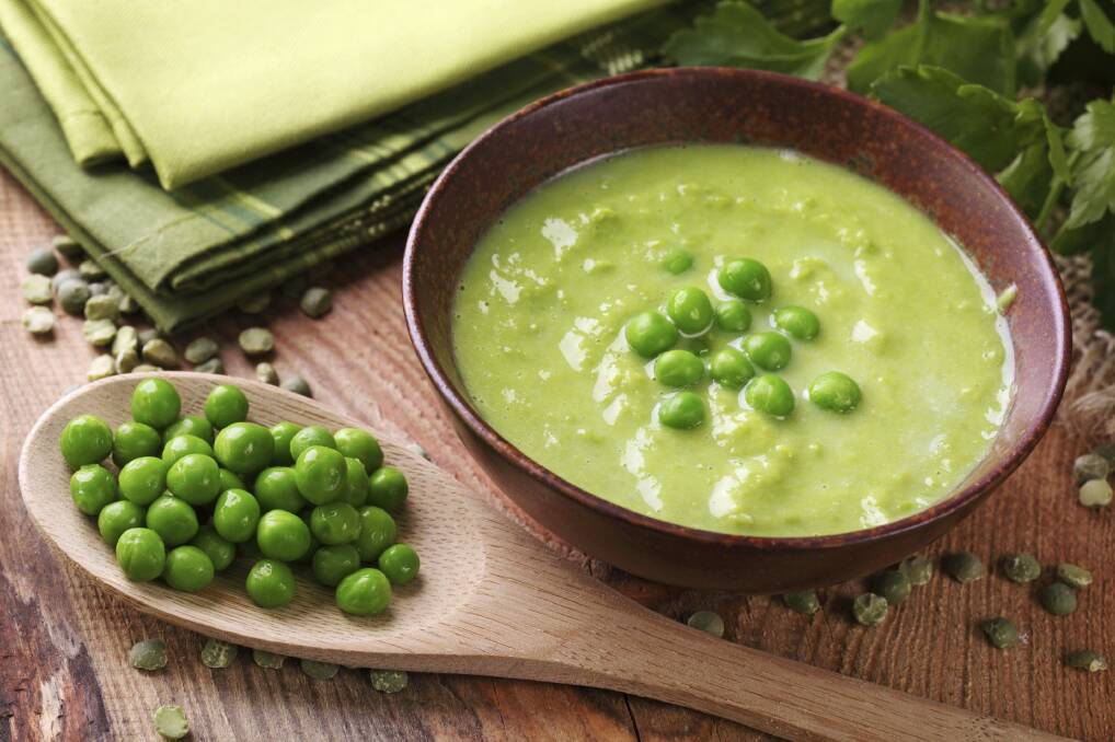 Fresh pea soup is delicious with a loaf of crusty seeded bread. Photo: iStock