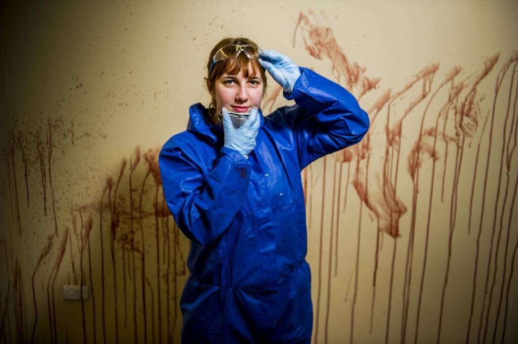 CIT forensic science student Stephanie Oliver  learns about blood splatters at the institute's specialised crime scene facility. Photo: Jay Cronan