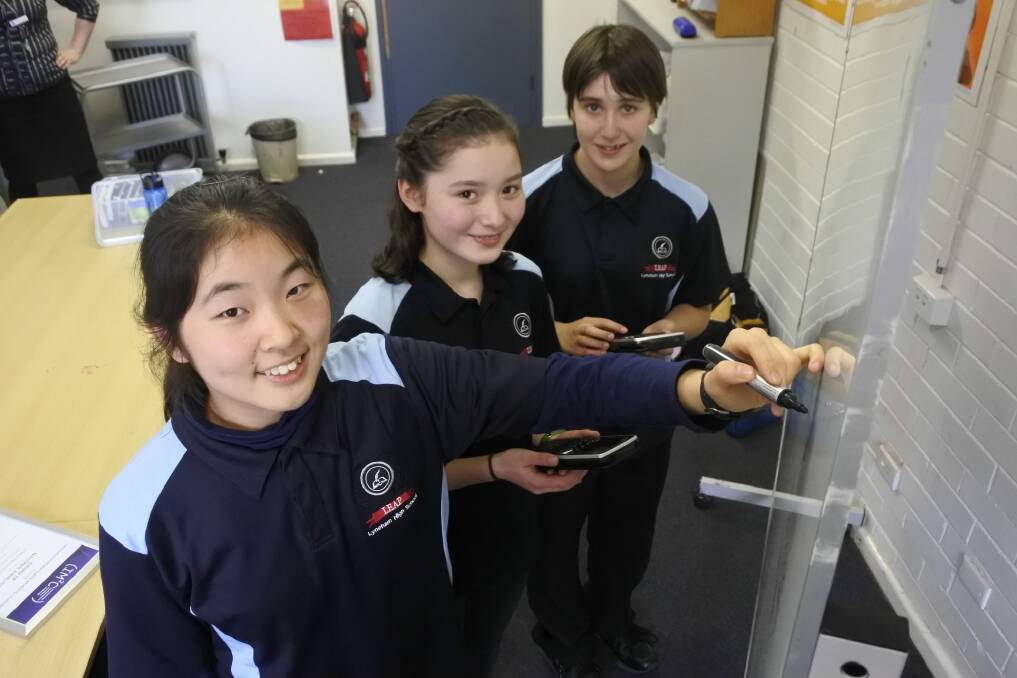 Lyneham High School students Enling Liao, Emi Callaway and Jessica Hill were national finalists in the International Mathematical Modelling Challenge. Photo: Stephen Jeffery