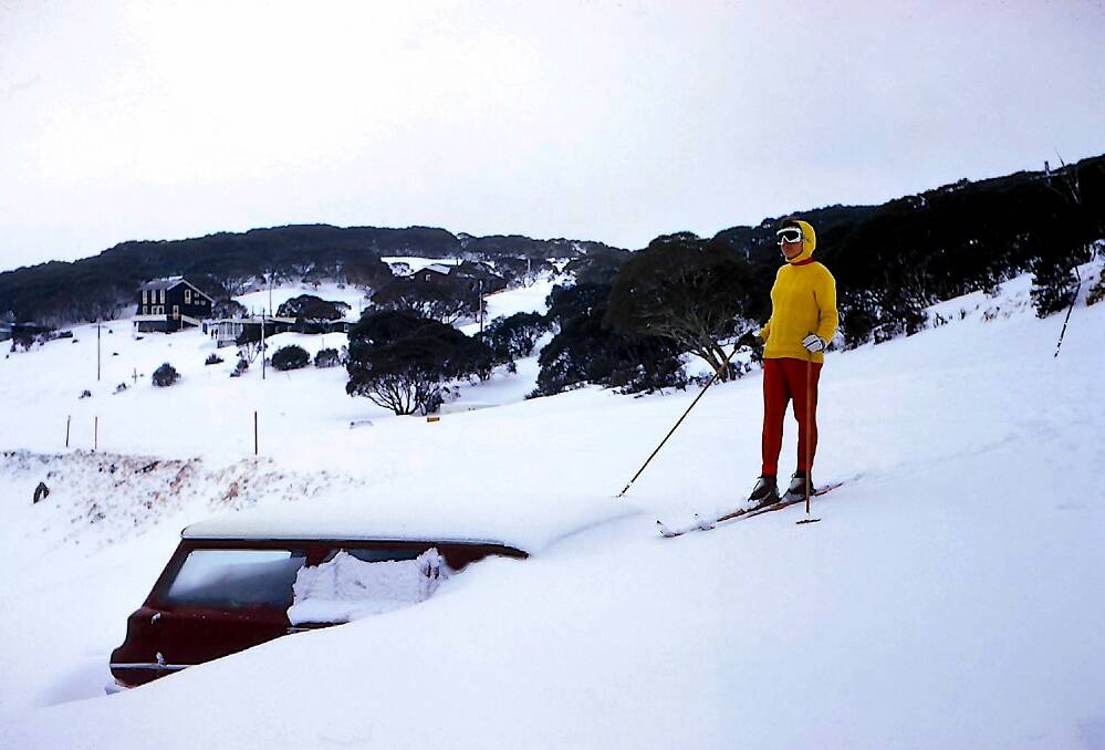 Who bought the shovel? A car half-buried in snow at Perisher in 1974.  Photo: Erwin Feeken