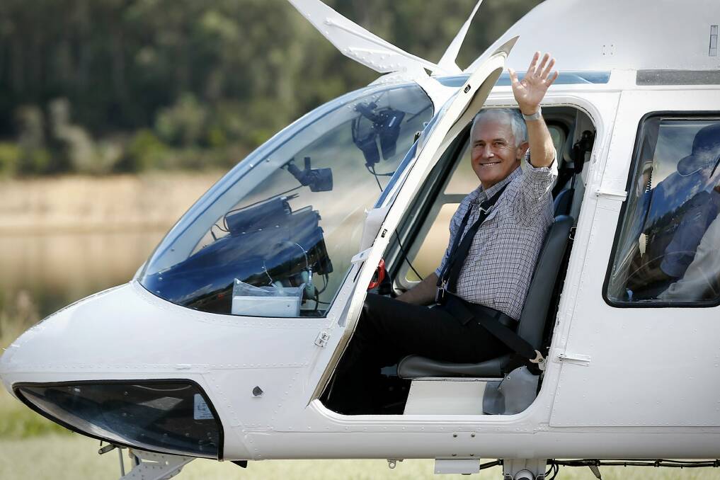 Prime Minister Malcolm Turnbull boards a helicopter to take an aerial tour of Snowy Hydro Tumut 3 power station, at Talbingo, NSW. Photo: Alex Ellinghausen