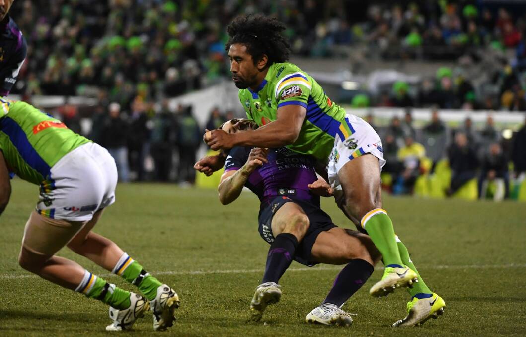 Knockout blow: Sia Soliola takes out Billy Slater. Photo: AAP