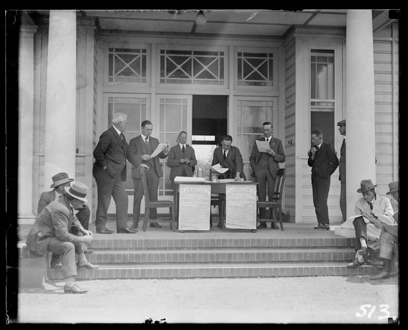 Harry Calthorpe and W.G. Woodger (the men behind the table) at a 1920s Canberra land sale. Courtesy National Archives of Australia. Photo: National Archives of Australia