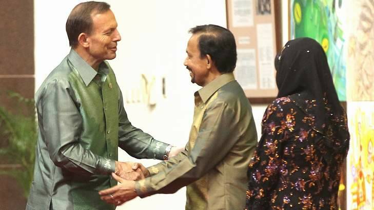 Sultan of Brunei Haji Hassanal Bolkiah greets Prime Minister Tony Abbott last October. Photo: Alex Ellinghausen