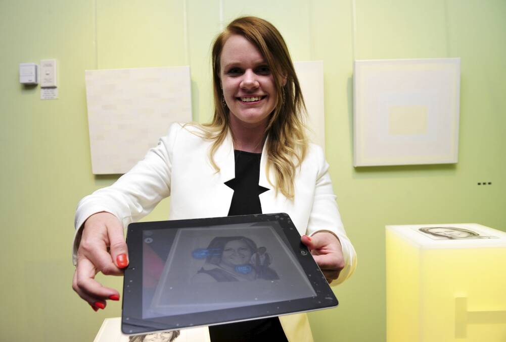 Amber Standley, 30 at the Think. Create. Innovate. Canberra exhibition with her augmented reality app. Photo: Melissa Adams