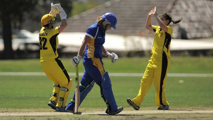 Rhiannon Dick is dismissed to the delight of Fury players, Jenny Wallace and Gemma Triscari. Photo: Graham Tidy