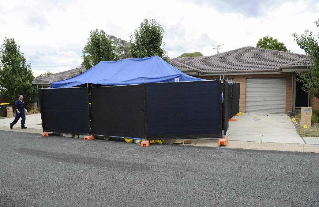 Forensic teams were still at the house on Thursday morning.  Photo: Graham Tidy