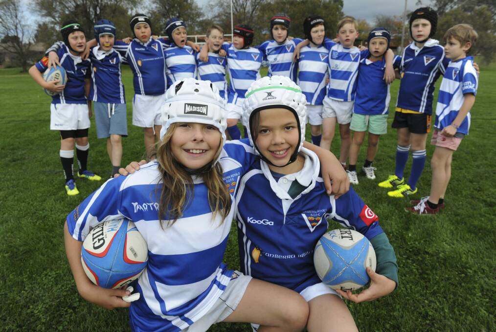 Royals under-10 rugby union team, with Dusty-Rose Bates, left, and Lizzy Marshall at the front.
 Photo: Graham Tidy