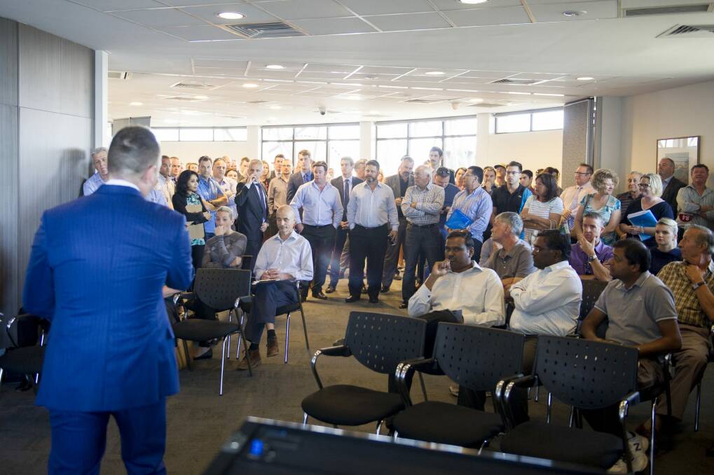 Auctioneer Andrew Cooley at Telstra Tower for an auction for a service station site at Weston Creek that sold for $5.75 million. Photo: Jay Cronan