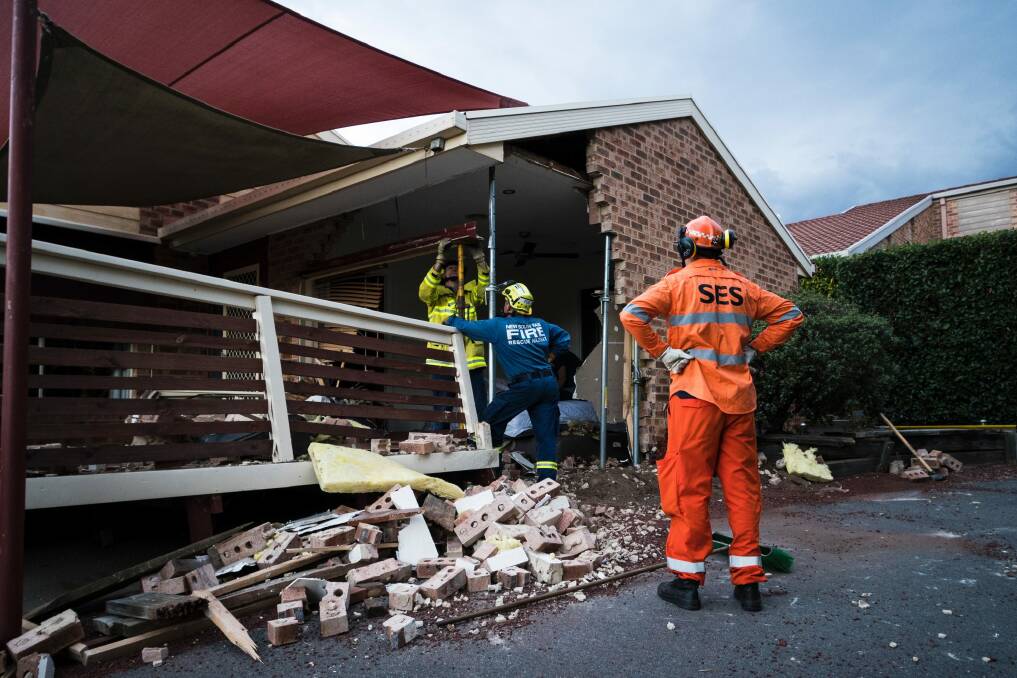 Emergency crews survey the damage. Photo: Dion Georgopoulos