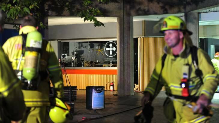 Emergency Services investigate a fire at the two before ten cafe and coffee roasters, Canberra House Arcade. Photo: Melissa Adams