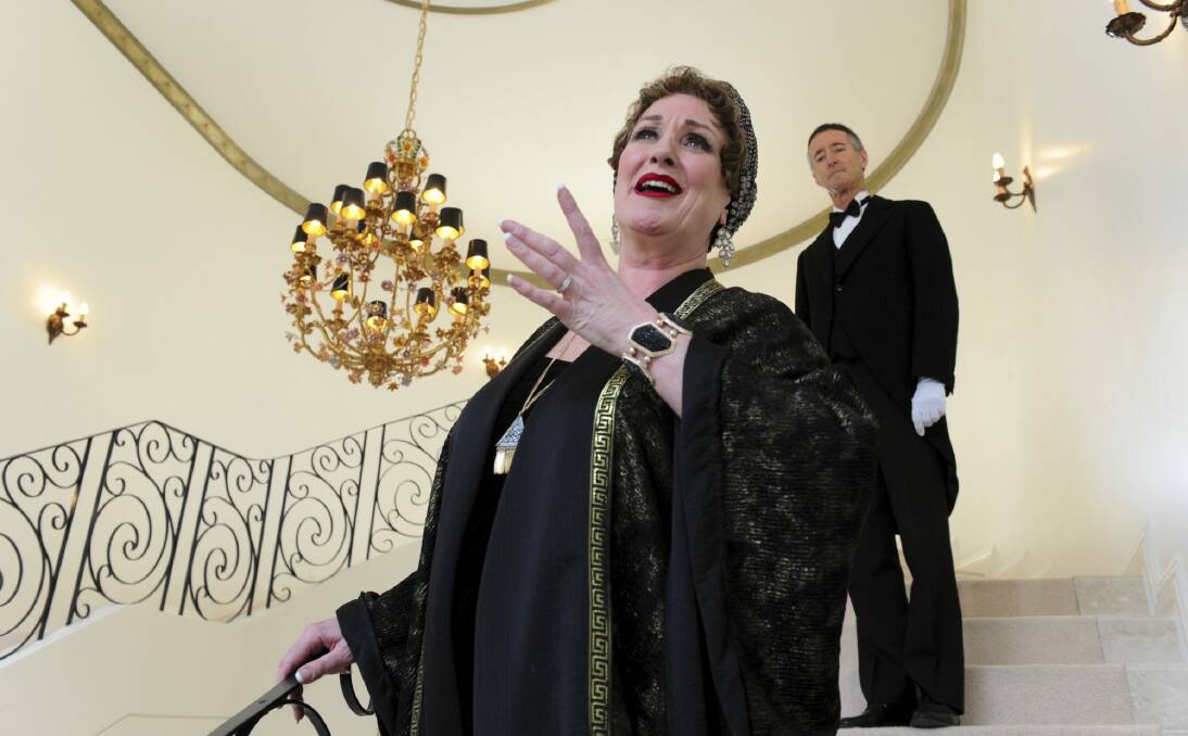 Bronwyn Sullivan rehearses for her role as Norma Desmond in the Queanbeyan Performing Arts Centre production of Sunset Boulevard as her butler, Peter Dark stands behind her. Photo: Graham Tidy