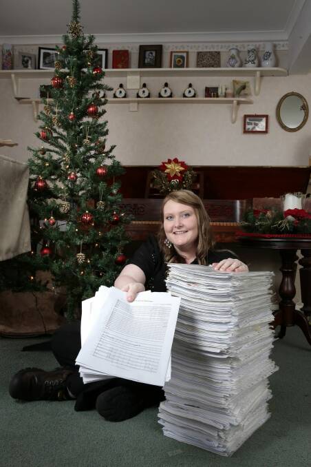 Special touch: Canberra composer Sally Greenaway with copies of her song. Photo: Jeffrey Chan