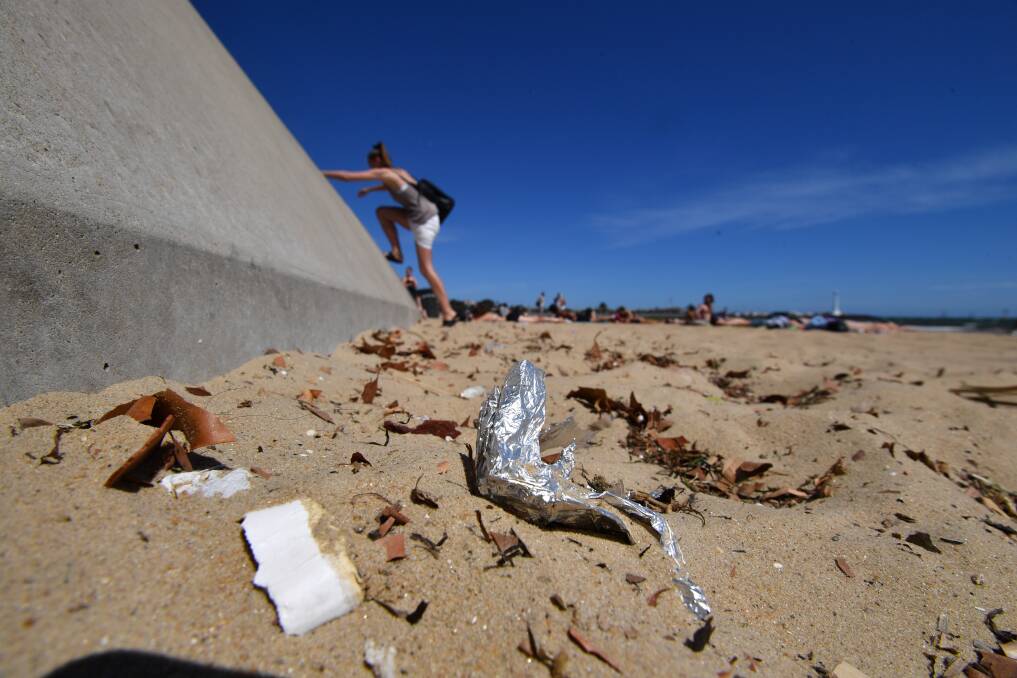 Rubbish on the sand at St Kilda beach. Photo: Joe Armao
