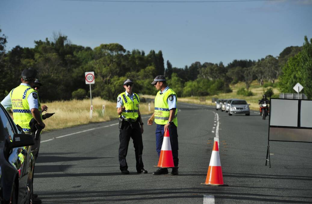 Police secure   the crash site on the Monaro Highway.