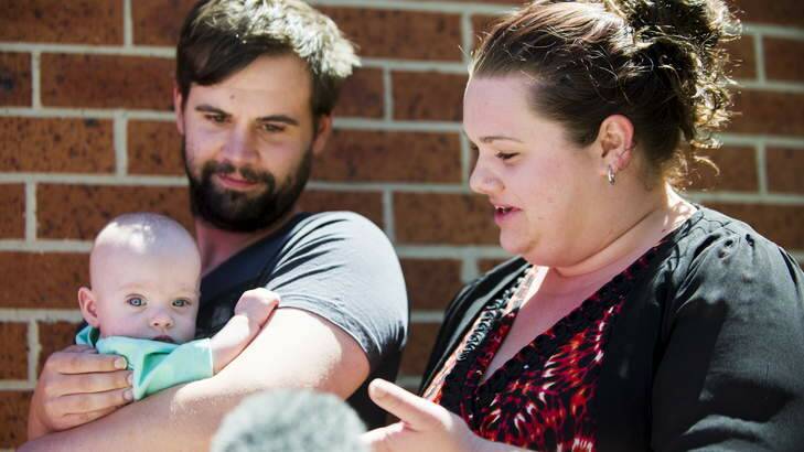 Seven-month-old Morrison with his parents Patrick and Kristen, as they thank police for their help after Morrison was taken during a car theft. Photo: Rohan Thomson