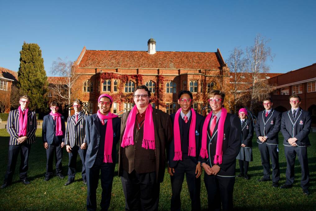 Miguel Salcedo, University of Canberra researcher Dr Robert McCuaig, Emman Salcedo and Nick Dimoff get into the spirit of Pink Day at Canberra Grammar School. Photo: Sitthixay Ditthavong
