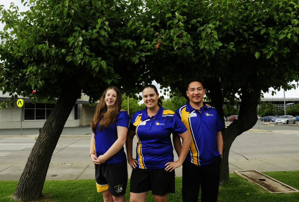 Competing in the 2016 Australian Deaf Games held in Adelaide are from left, Sarah Ashleigh,16 of Farrer (netball and athletics), Chloe Nash,29 of Conder (netball and touch football) and Michael Louey,47 of Casey (table tennis). Photo: Melissa Adams 