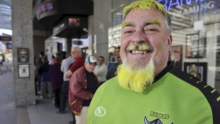 Raiders supporter Mick Lennon lines up for tickets to Sunday's elimination final against the Cronulla Sharks at Canberra Stadium. Photo: Jay Cronan