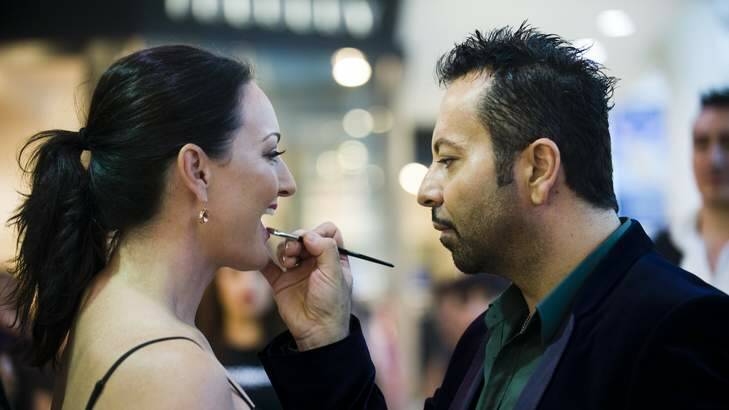 Napoleon Perdis touches up Melanie Hindson of Deakin's make-up during make-up masterclass. Photo: Elesa Kurtz