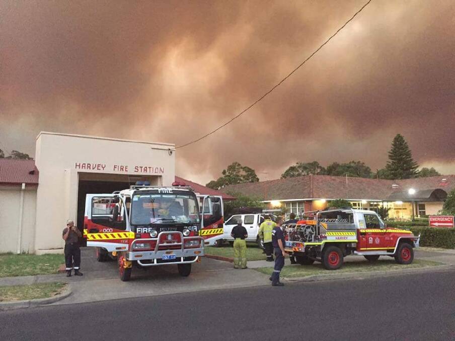 Weary firefighters at Harvey Fire Station in Western Australia on Monday.  Photo: Scott Britza