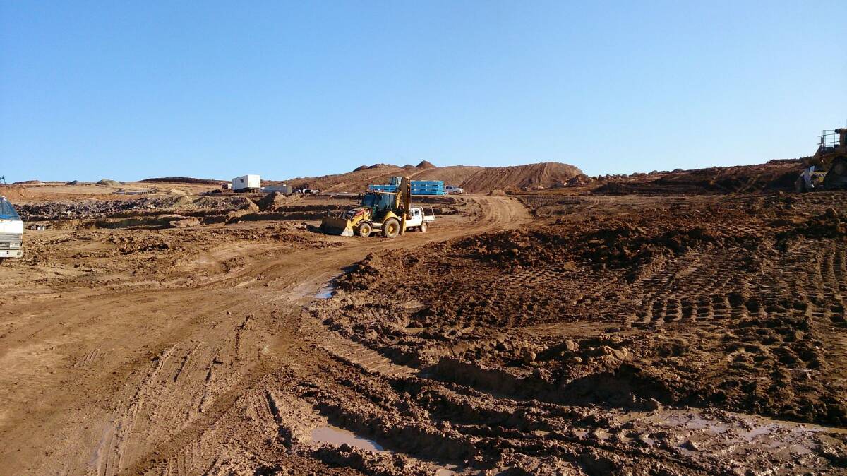 Bulldozers work last year on the early stages of laying out Denman Prospect.